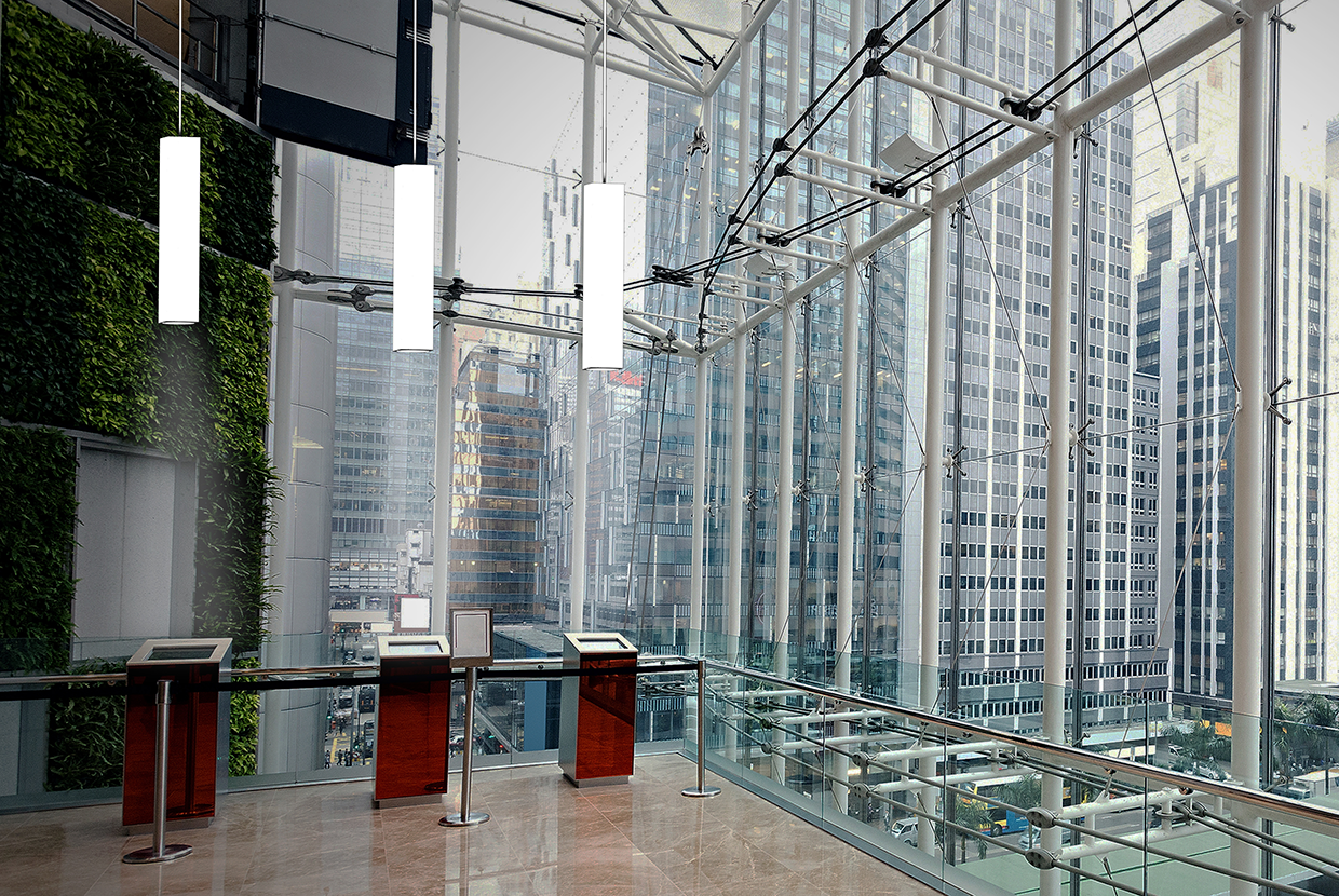 Skyscraper with glass atrium and luminous rectilinear pendants