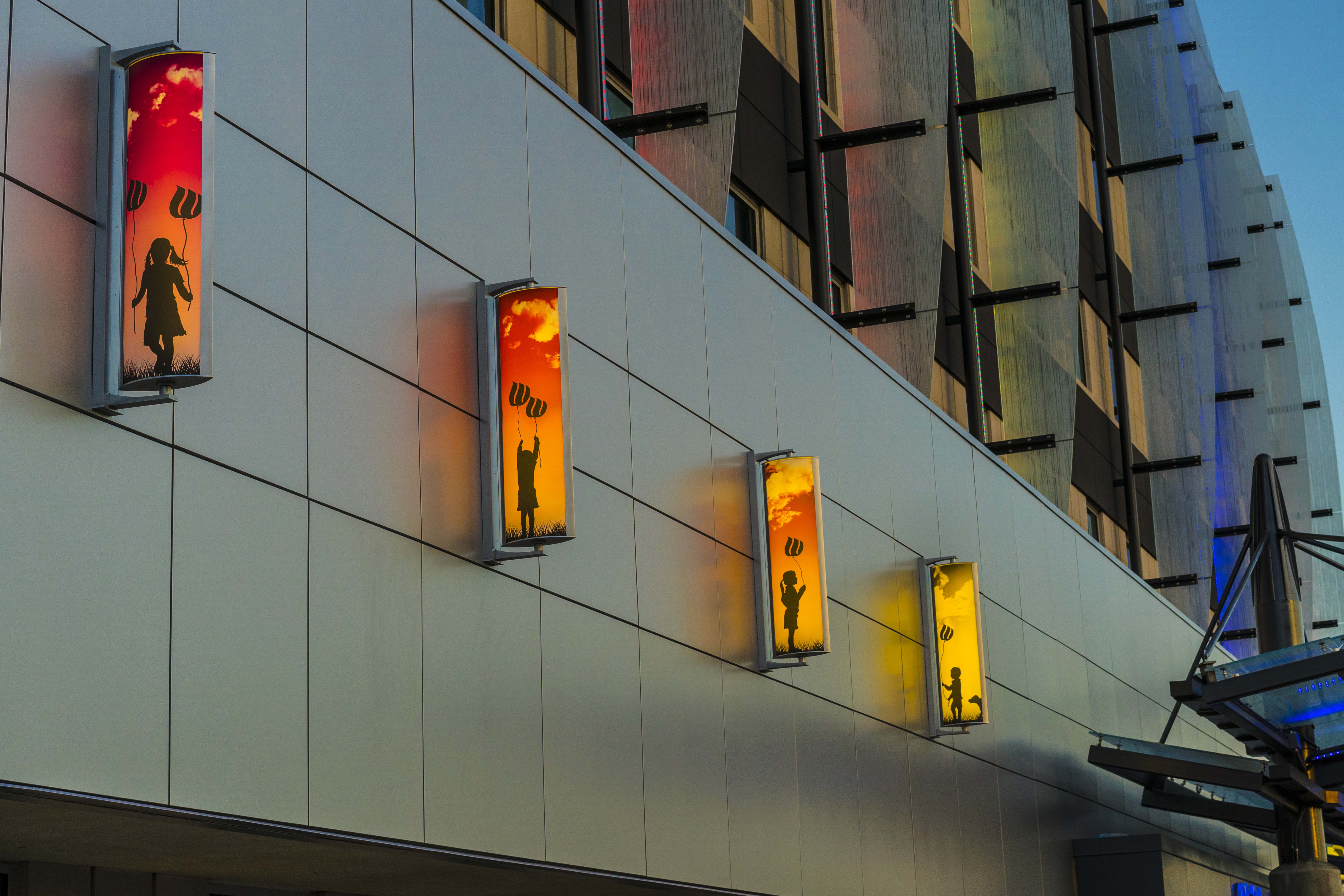 Outdoor lighting with colorful custom graphics on Children's Hospital