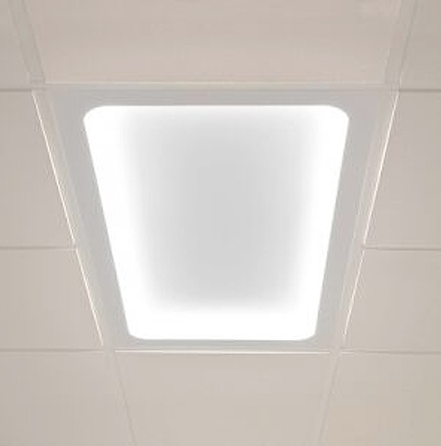 Hospital patient room ceiling light with soft rounded corners and LED light by Visa Lighting